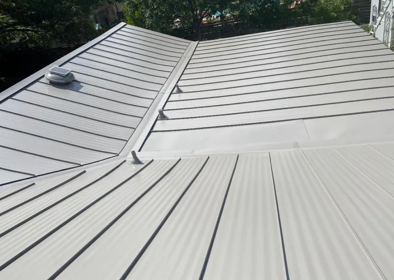 Solar attic fan installed on a metal roof for Roof Ventilation in Corrales